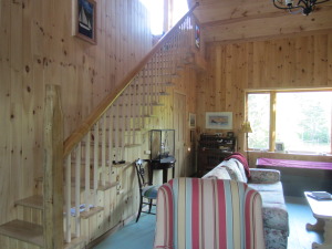 Stairs up to the loft area. Take a look at the banister it was the original mast of the Trillium . The mast broke in a big storm many years ago getting caught in a tree when it broke from its mooring. Sadly it reinforces our idea that you should never throw anything away!