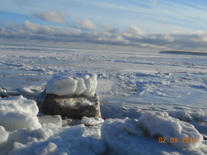 Large ice chunk deposited on top of the very large rock