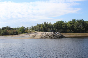 boat launch and picnic area on village side of Port Neuf sur mer. The wharf is connected either by crossing the water or driving across the bridge on the highway